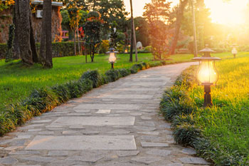 Outdoor landscape lighting on a custom hardscape walkway in Coral Gables, Florida